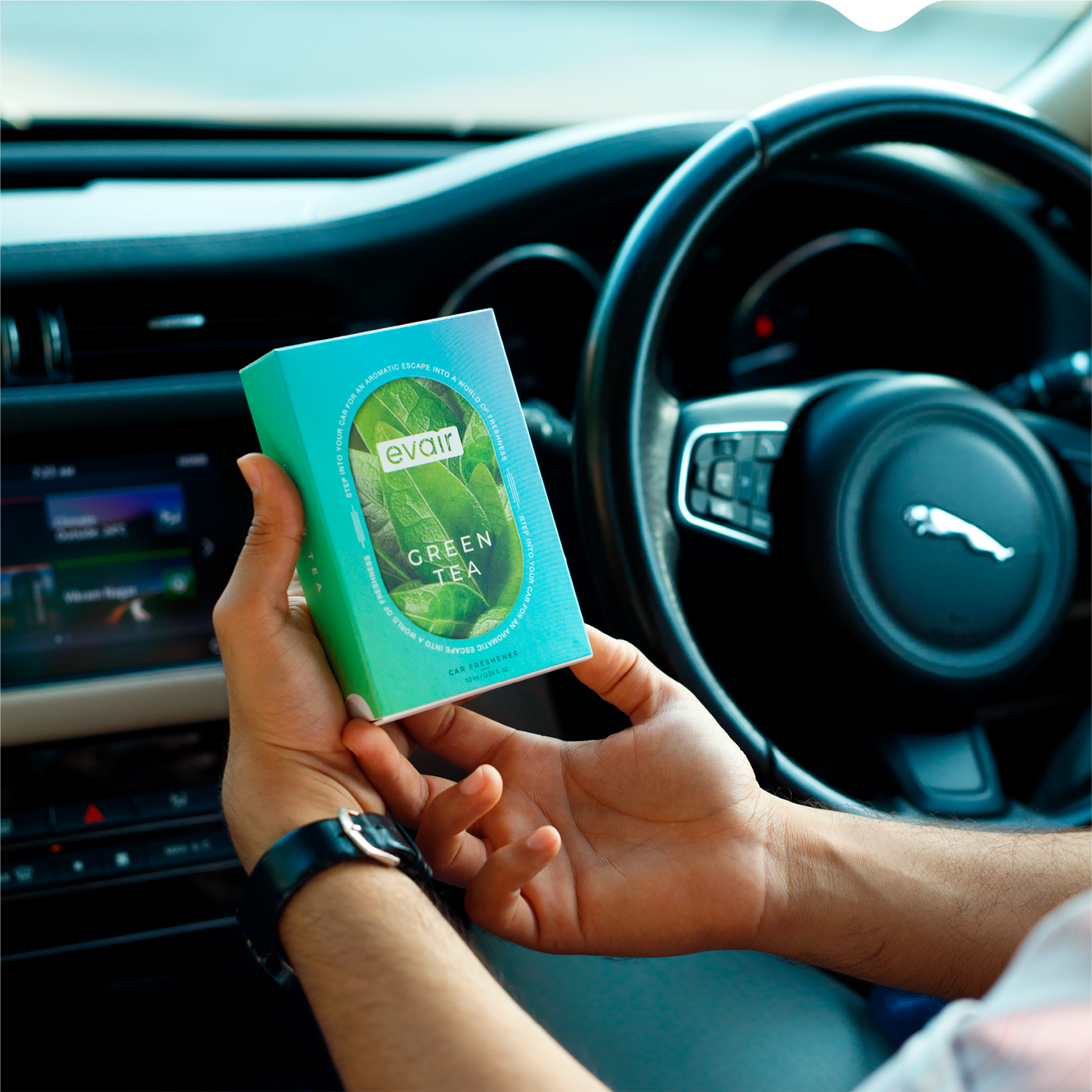 Men Holding Evair Green Tea Long lasting Perfume Car in car