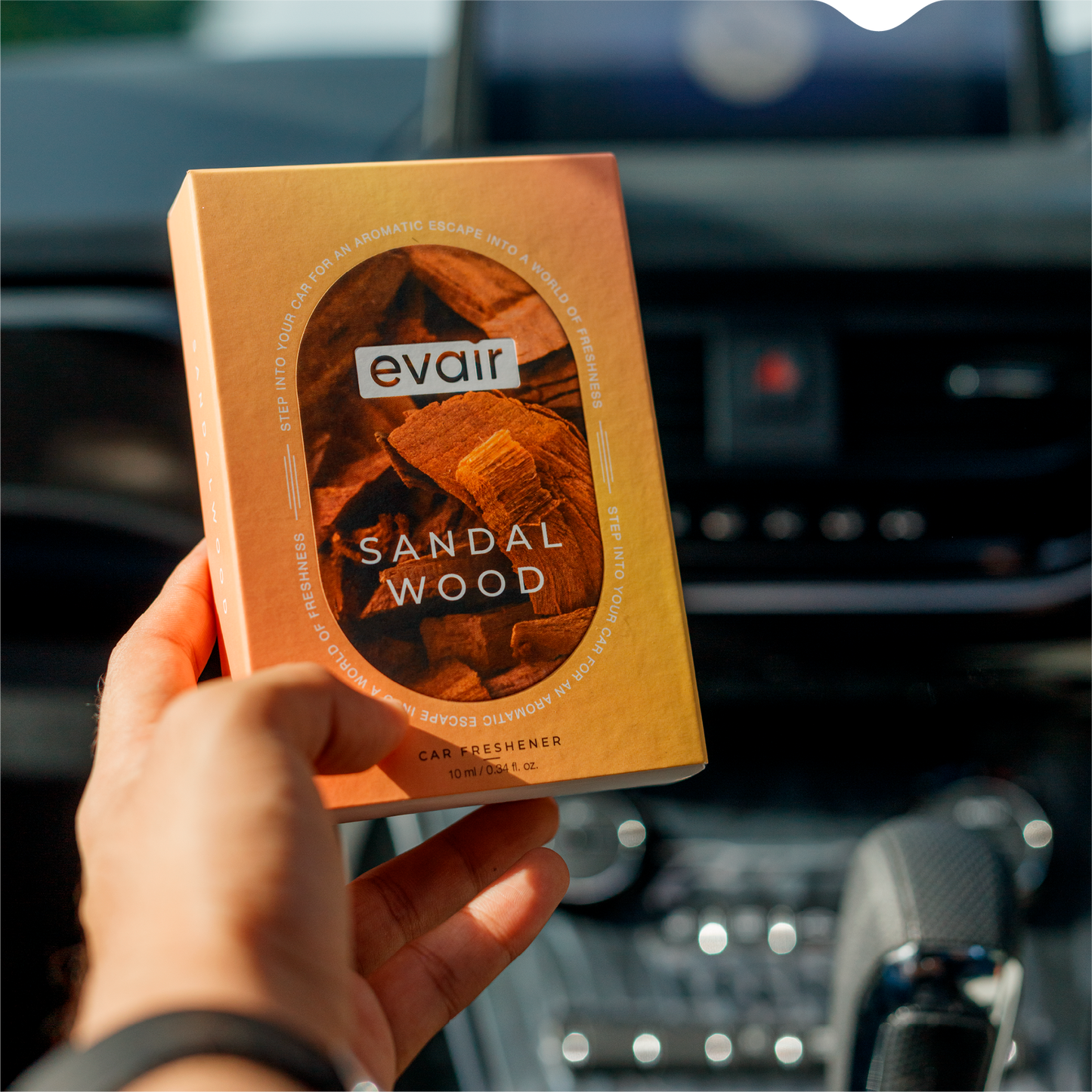 Men Holding Evair Sandalwood Long lasting Car Perfume in car