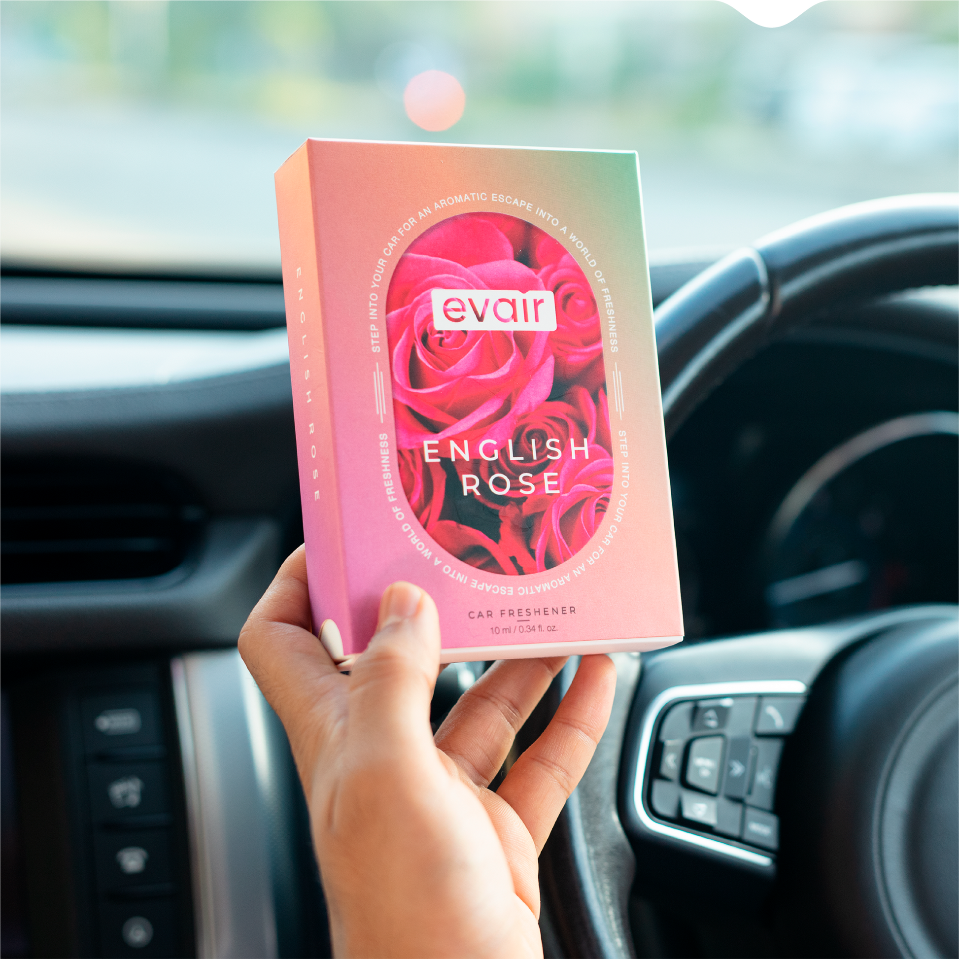 Men Holding Evair English Rose Long lasting Car Perfume in car